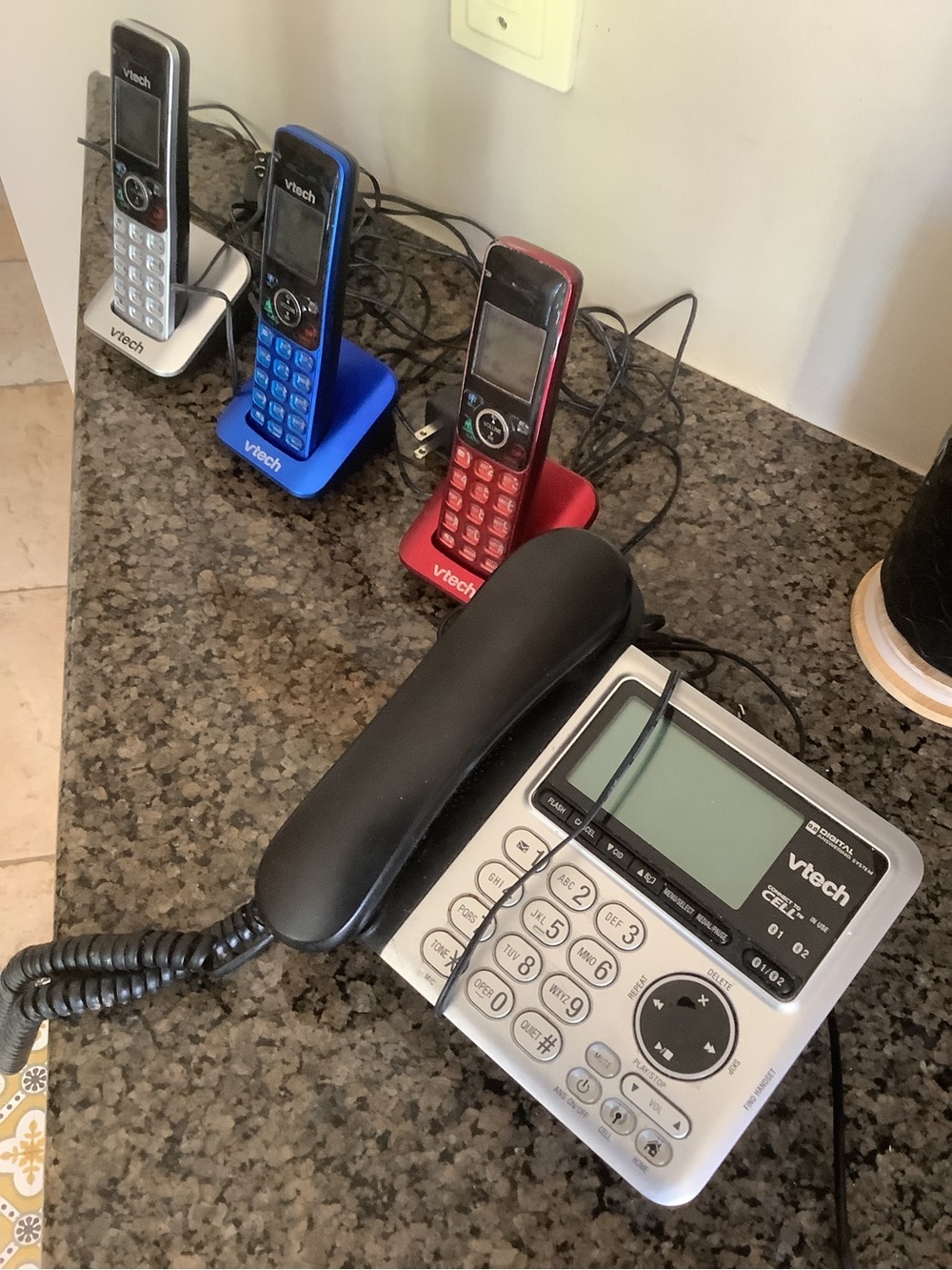 3 portable Phones plus 1 Silver Corded Desk Phone with Answering Machine